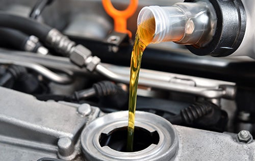 pouring car oil
